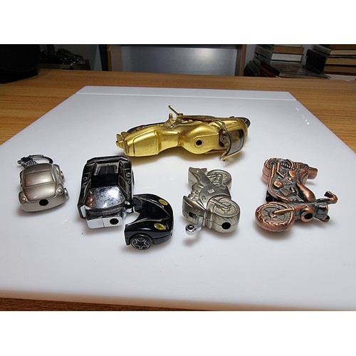 141 - A collection of 5x novelty collectable lighters in the form of motorcycles and cars to include a lar... 