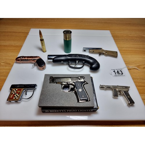 143 - A collection of 8 gun related collectable novelty lighters to include very rare Japanese collectable... 