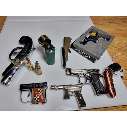 143 - A collection of 8 gun related collectable novelty lighters to include very rare Japanese collectable... 