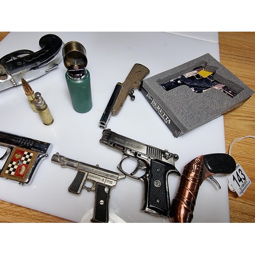 143 - A collection of 8 gun related collectable novelty lighters to include very rare Japanese collectable... 