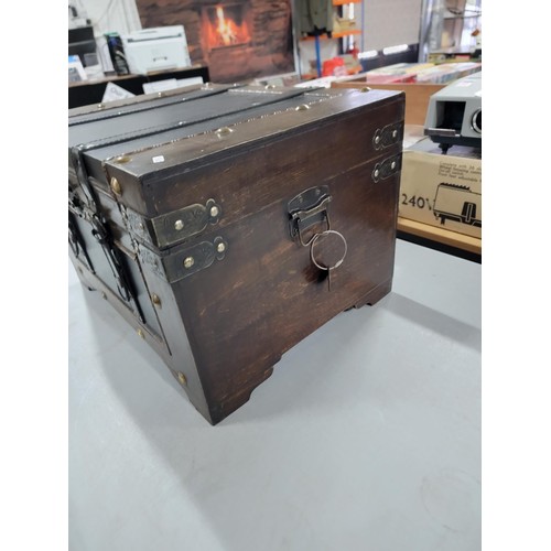 101 - Good quality leather bound studded storage chest in good order with leather straps, height 32cm leng... 