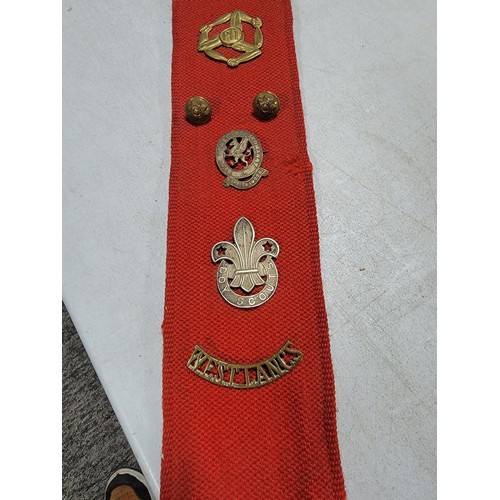 110 - Large red fabric wall hanger containing a large quantity of lapel badges inc RWF, RASC, REME, Boy Sc... 