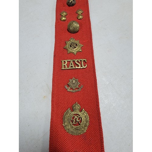 110 - Large red fabric wall hanger containing a large quantity of lapel badges inc RWF, RASC, REME, Boy Sc... 