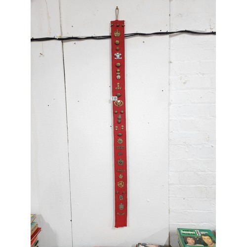 110 - Large red fabric wall hanger containing a large quantity of lapel badges inc RWF, RASC, REME, Boy Sc... 