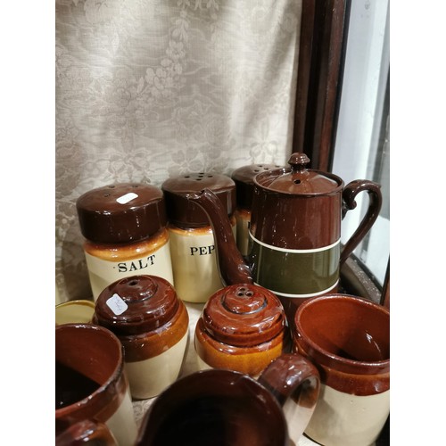 363 - Large quantity of stone ware salt glazed brown and tan jugs, storage jars, vinegar jugs, condiment s... 