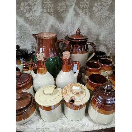 363 - Large quantity of stone ware salt glazed brown and tan jugs, storage jars, vinegar jugs, condiment s... 