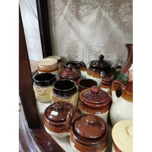 363 - Large quantity of stone ware salt glazed brown and tan jugs, storage jars, vinegar jugs, condiment s... 