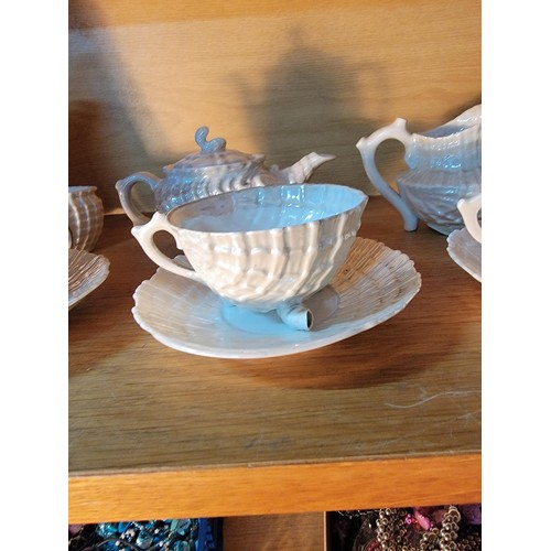 122 - 11x part teaset in a shell and pearlescent design in good order, inc teapot, lidded sugar bowl 2x cu... 