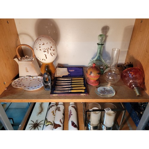 123 - Quantity of collectables inc a carved ostrich egg, cranberry glass light fitting, decanter along wit... 