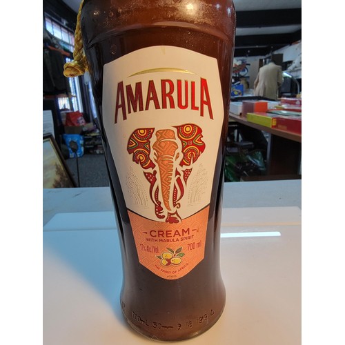 129 - Bottle of new and sealed Amarula liqueur 700ml complete with yellow rope