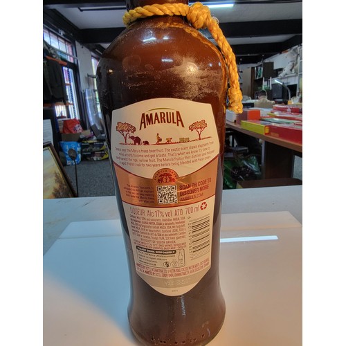 129 - Bottle of new and sealed Amarula liqueur 700ml complete with yellow rope