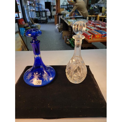 130 - Pair of good quality decanters inc a hand cut Bristol blue ships decanter along with a cut glass cry... 