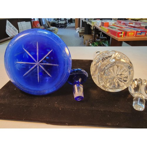 130 - Pair of good quality decanters inc a hand cut Bristol blue ships decanter along with a cut glass cry... 