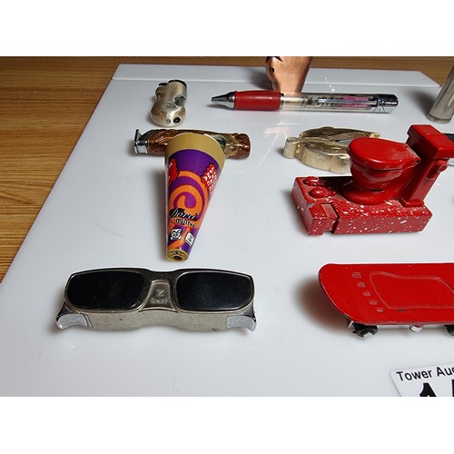 144 - A collection of 13x novelty collectable lighters featuring a finger scooter lighter, a toilet lighte... 