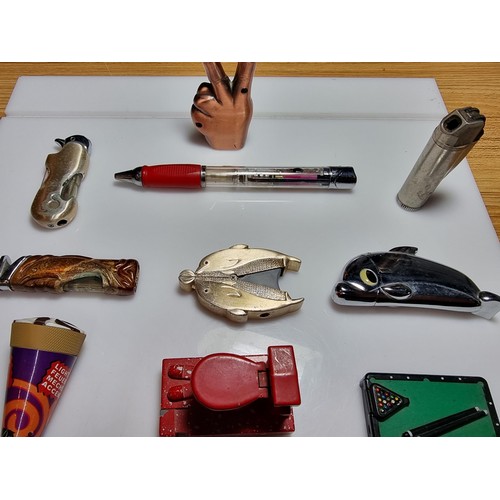 144 - A collection of 13x novelty collectable lighters featuring a finger scooter lighter, a toilet lighte... 