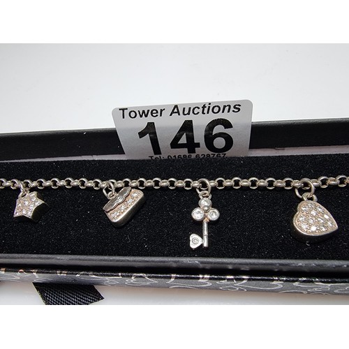 146 - A 925 silver charm bracelet with 7 charms all in set with crystal CZ stones, in clean condition, box... 