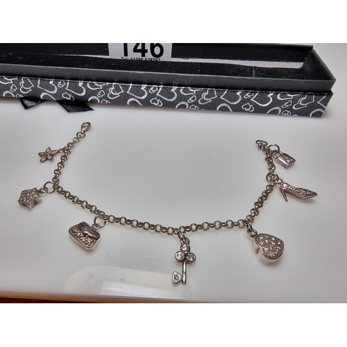 146 - A 925 silver charm bracelet with 7 charms all in set with crystal CZ stones, in clean condition, box... 