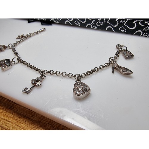 146 - A 925 silver charm bracelet with 7 charms all in set with crystal CZ stones, in clean condition, box... 