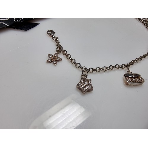 146 - A 925 silver charm bracelet with 7 charms all in set with crystal CZ stones, in clean condition, box... 