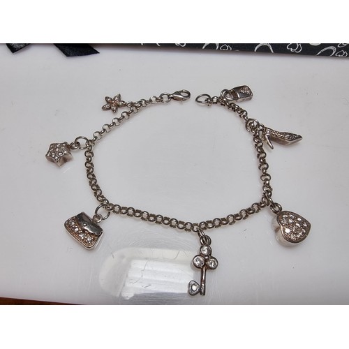 146 - A 925 silver charm bracelet with 7 charms all in set with crystal CZ stones, in clean condition, box... 