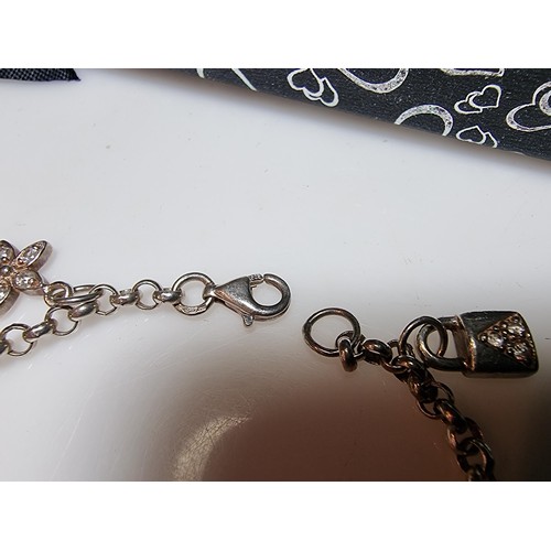 146 - A 925 silver charm bracelet with 7 charms all in set with crystal CZ stones, in clean condition, box... 