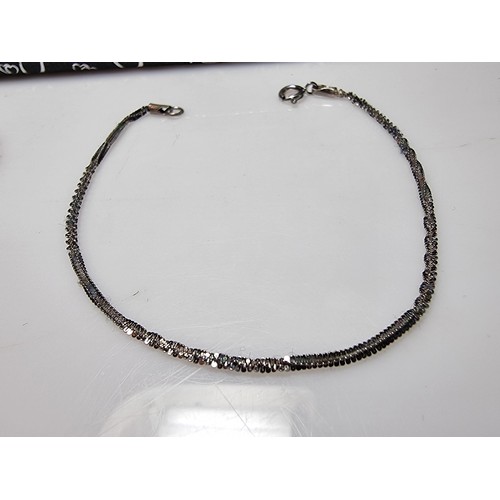 149 - 2x 925 silver bracelets, one with a Figaro curb link design the other with a twisted design. Both in... 