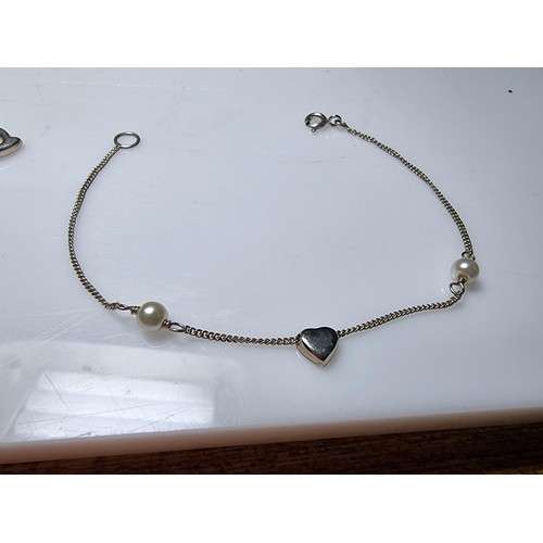 150 - A bundle of 2x 925 silver bracelets, 1 with a Belcher link design with a heart charm, the other with... 