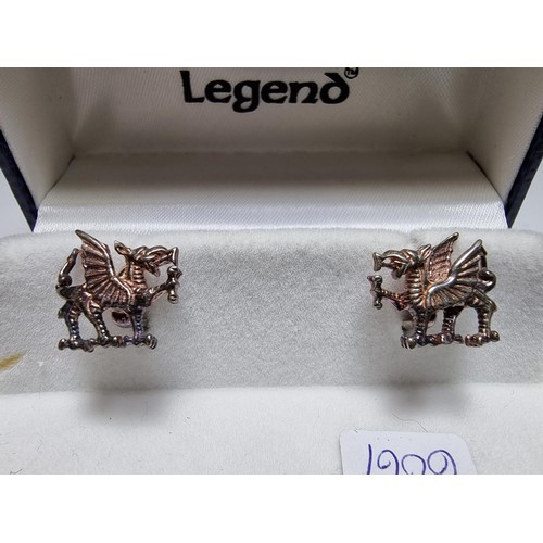 151 - A boxed as new The Celtic Legend sterling silver Welsh Dragon Cufflinks, hand crafted presenting exc... 