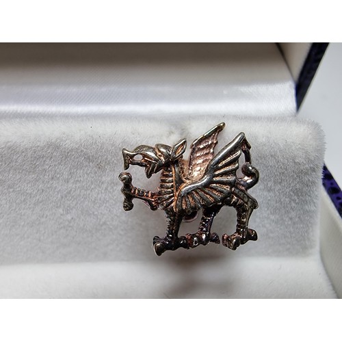 151 - A boxed as new The Celtic Legend sterling silver Welsh Dragon Cufflinks, hand crafted presenting exc... 