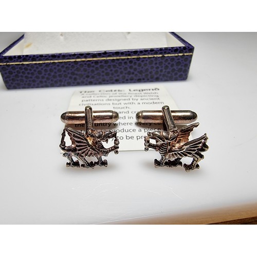 151 - A boxed as new The Celtic Legend sterling silver Welsh Dragon Cufflinks, hand crafted presenting exc... 