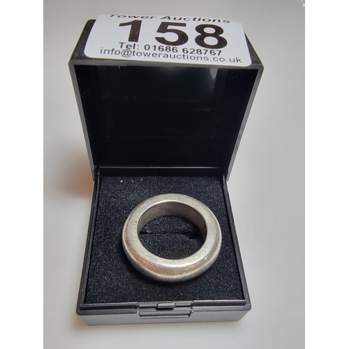 158 - A very chunky unusual 925 silver ring of a good weight, the ring band is 7mm wide and has a weight o... 