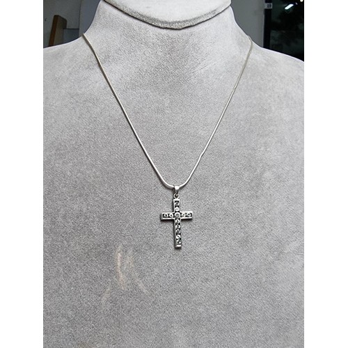 160 - A 925 silver cross pendant inset with CZ crystal stones on an 18