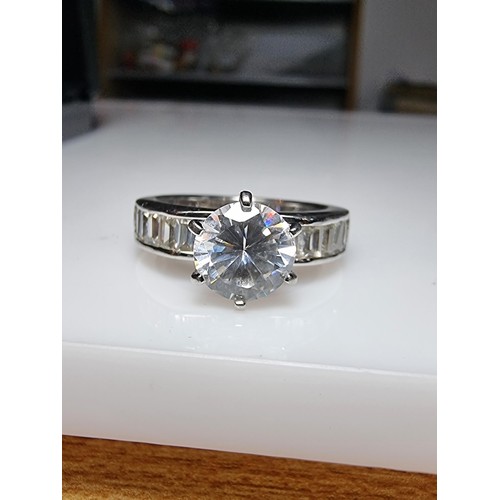 161 - An attractive chunky 925 silver dress ring with a large sparkly CZ crystal stone to the centre with ... 