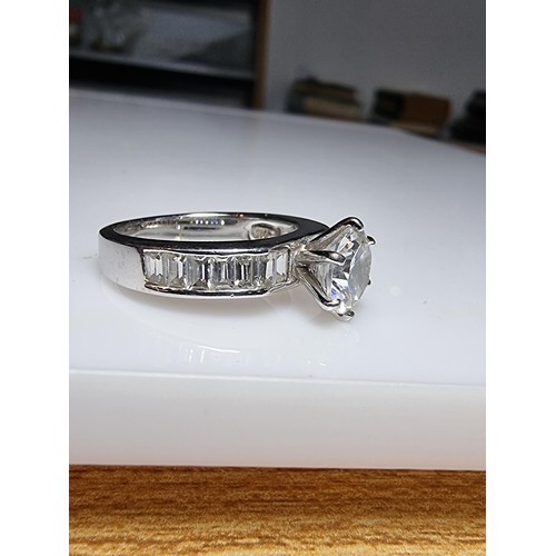 161 - An attractive chunky 925 silver dress ring with a large sparkly CZ crystal stone to the centre with ... 