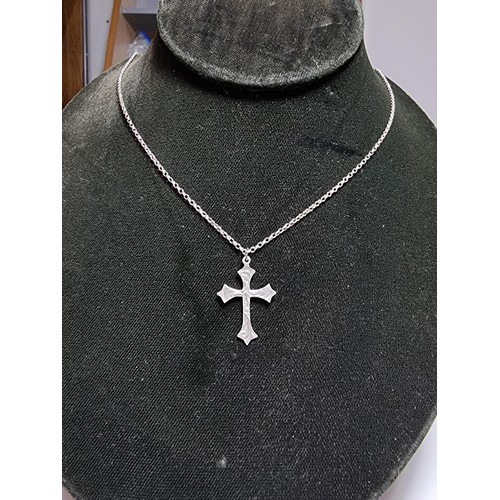 162 - A 925 silver engraved cross pendant set on a good 18