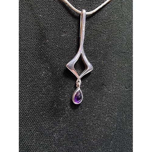 163 - An as new 925 silver drop pendant inset with an amethyst stone by Kit Heath set on an 18