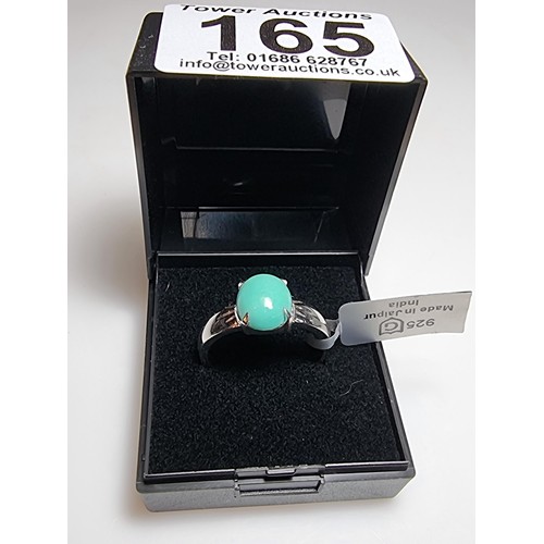 165 - A brand new 925 silver dress ring inset with a turquoise stone. In excellent clean unused condition,... 