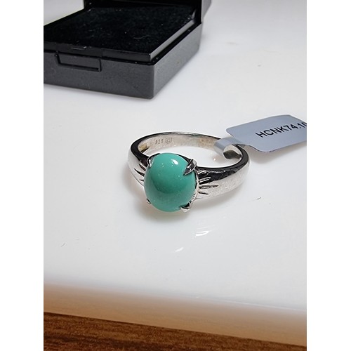 165 - A brand new 925 silver dress ring inset with a turquoise stone. In excellent clean unused condition,... 