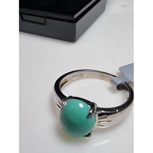 165 - A brand new 925 silver dress ring inset with a turquoise stone. In excellent clean unused condition,... 