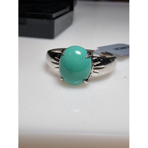 165 - A brand new 925 silver dress ring inset with a turquoise stone. In excellent clean unused condition,... 