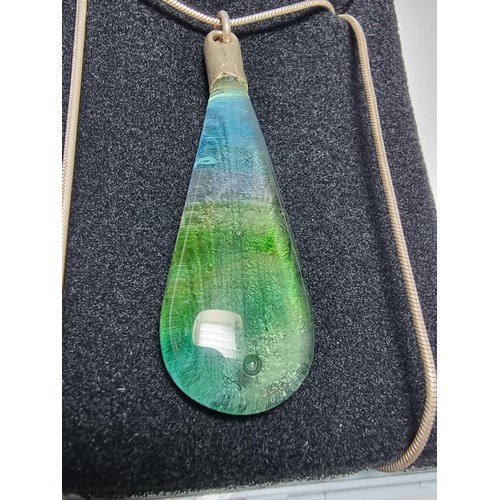 166 - A pretty art glass pendant with colours from green to red to blue set on a 925 silver 16