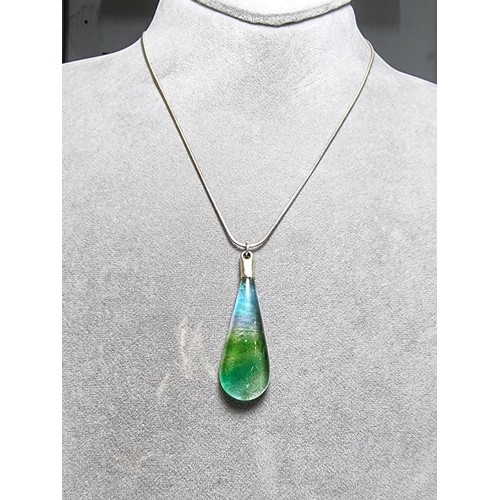 166 - A pretty art glass pendant with colours from green to red to blue set on a 925 silver 16