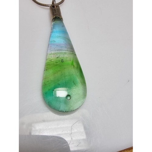 166 - A pretty art glass pendant with colours from green to red to blue set on a 925 silver 16