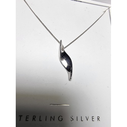 171 - An as new sterling silver pendant by NEXT on an 18