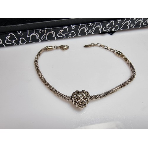 173 - A 925 silver bracelet with a heart charm by Chamilia. In good clean condition and boxed. Length 8