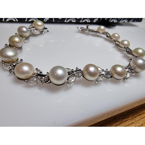 174 - A pretty as new 925 silver genuine pearl necklace inset with 13 pearls and a quantity of CZ crystal ... 