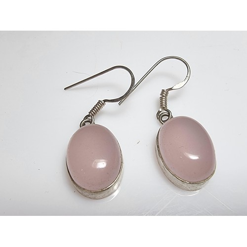 178 - A pair of pretty 925 silver drop earrings inset with large rose quartz cabochon stones. In good clea... 