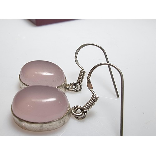 178 - A pair of pretty 925 silver drop earrings inset with large rose quartz cabochon stones. In good clea... 