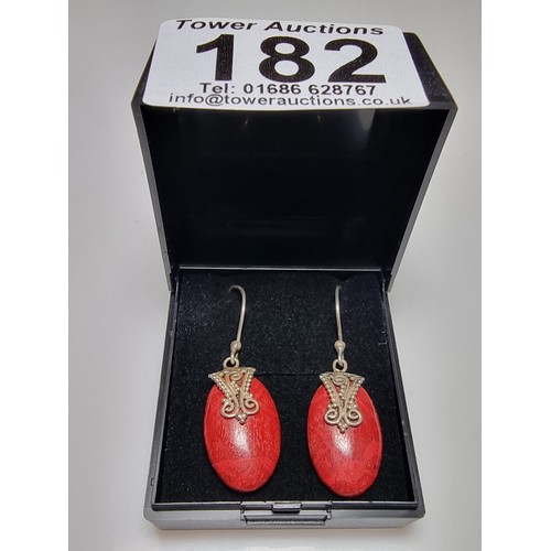 182 - A pair of pretty 925 silver and red stained wood earrings with an ornate design. In good clean condi... 