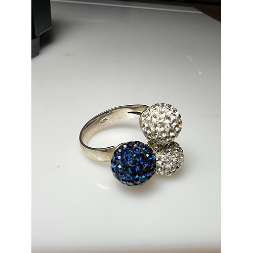 184 - A 925 silver unusual ring with 3 large balls in set with clear studded crystals and blue studded cry... 